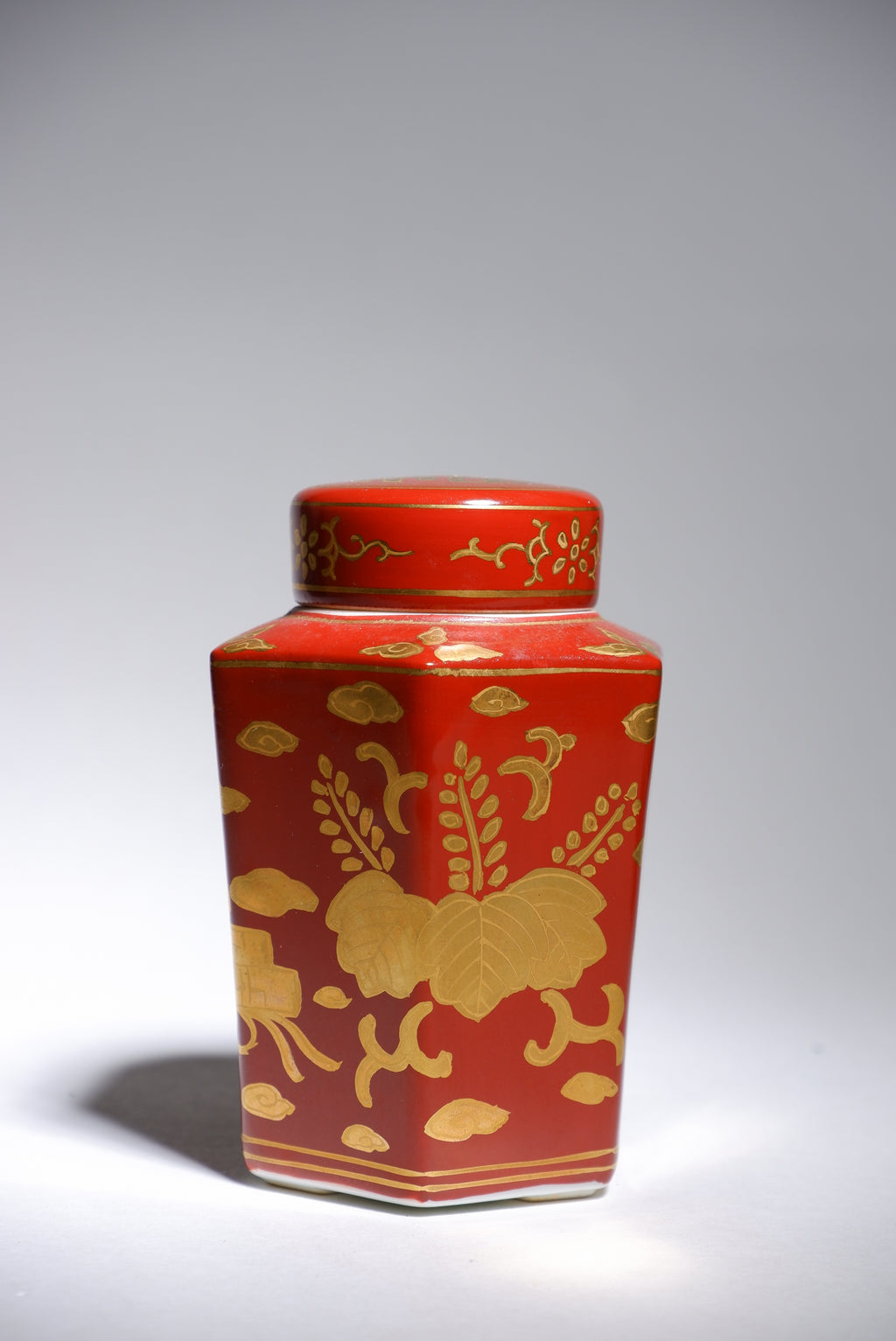 Harumine  Tea Caddy with Phoenix Design on Red Ground and Kinrande Decoration