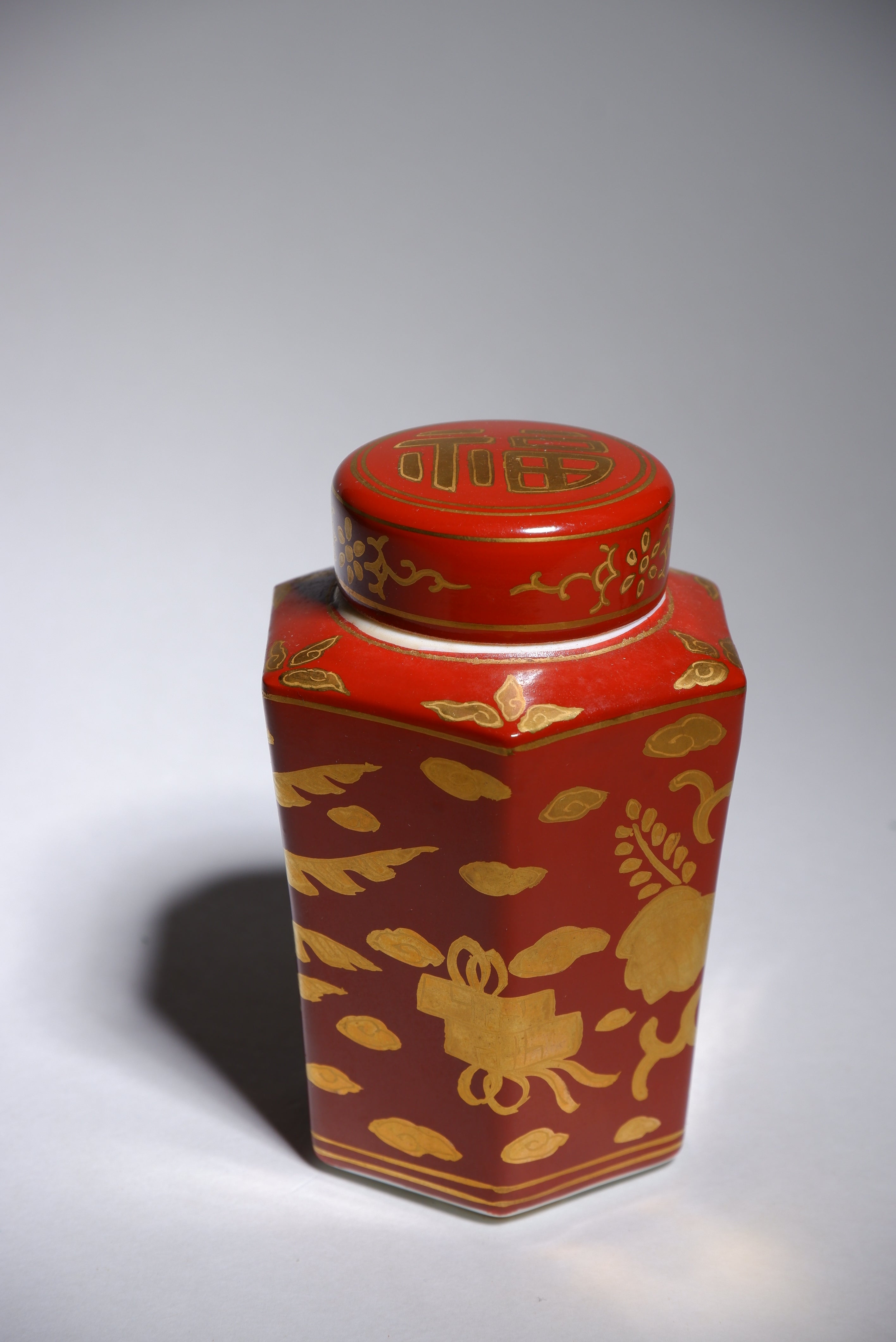 Harumine  Tea Caddy with Phoenix Design on Red Ground and Kinrande Decoration
